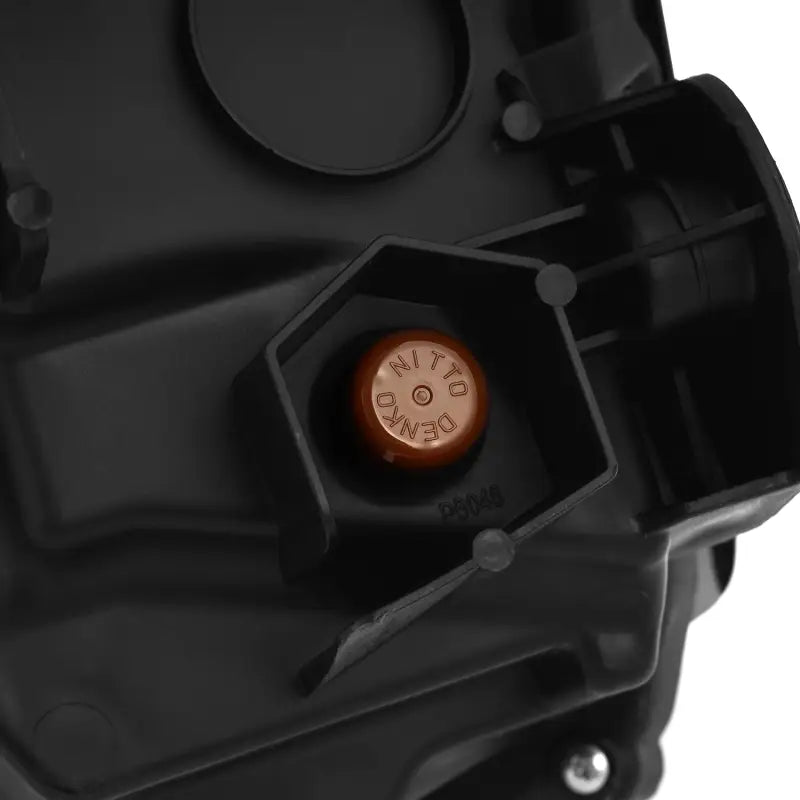 Close-up of a Nitto Denko component in the AlphaRex NOVA-Series LED projector headlights, emphasizing high-quality materials and engineering.