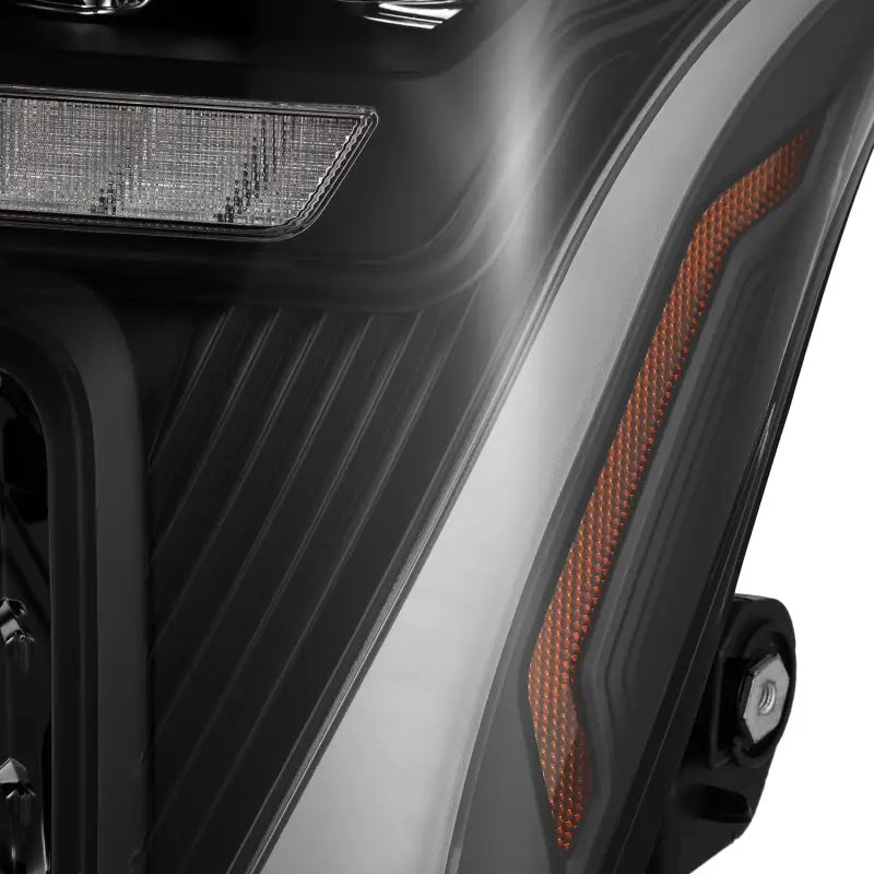 Detailed view of the amber reflector and textured housing on AlphaRex NOVA-Series LED projector headlights, emphasizing safety and style.