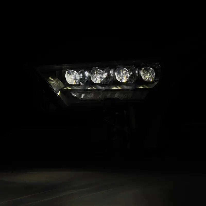 AlphaRex NOVA-Series LED projector headlight in a dimly lit environment, showcasing its advanced lighting technology and beam clarity.