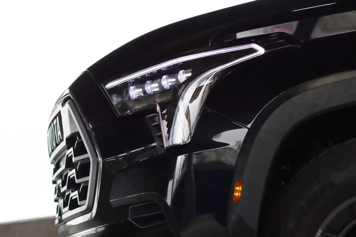Side view of AlphaRex NOVA-Series LED projector headlights on a Toyota Tundra, highlighting the sharp and modern headlight design.