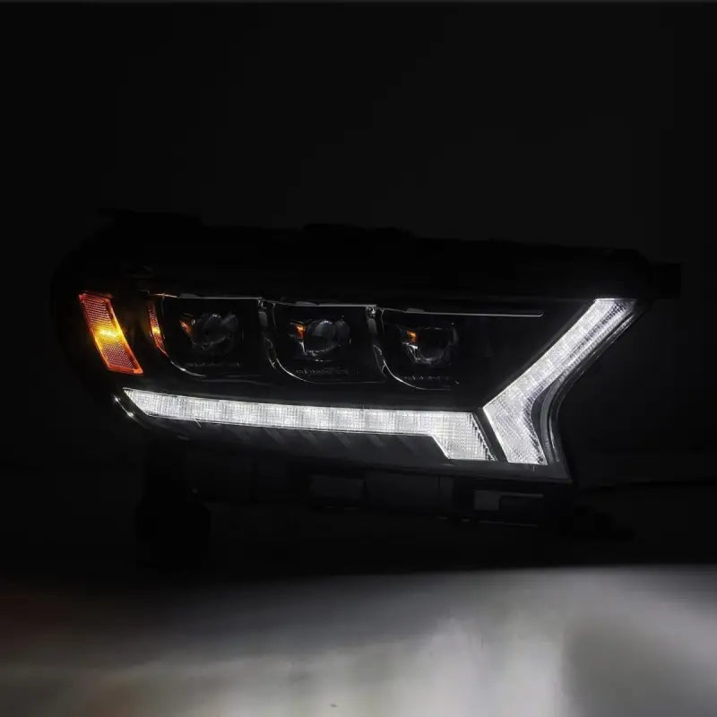 Ford Ranger 19-22 LED projector headlights with white DRL and amber turn signal light activated, emphasizing dual functionality.
