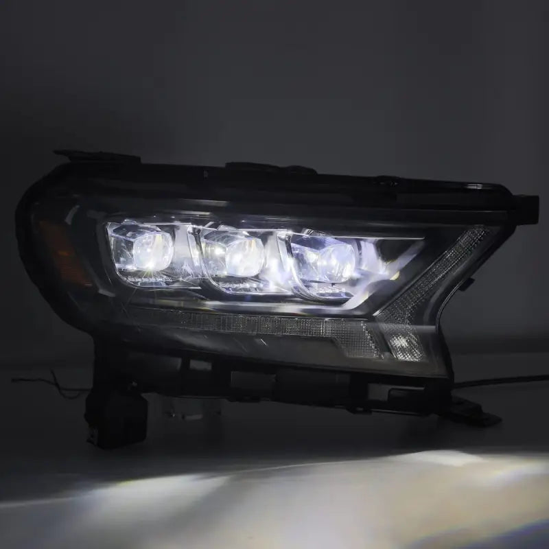 Ford Ranger 19-22 LED projector headlights emitting powerful white light, highlighting their advanced illumination capabilities.