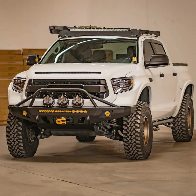 White Toyota Tundra with Overland Series front bumper featuring winch compatibility, off-road lights, and enhanced clearance.