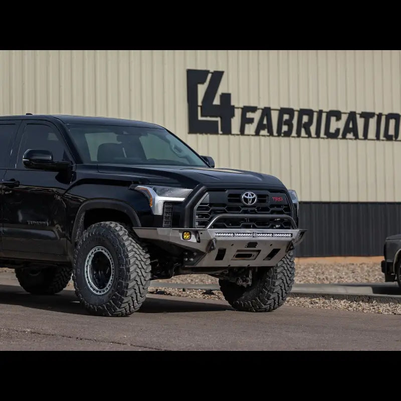 Tundra Overland Series Front Bumper for 2022+ models, installed on a black Tundra, featuring a durable design and light bar integration.