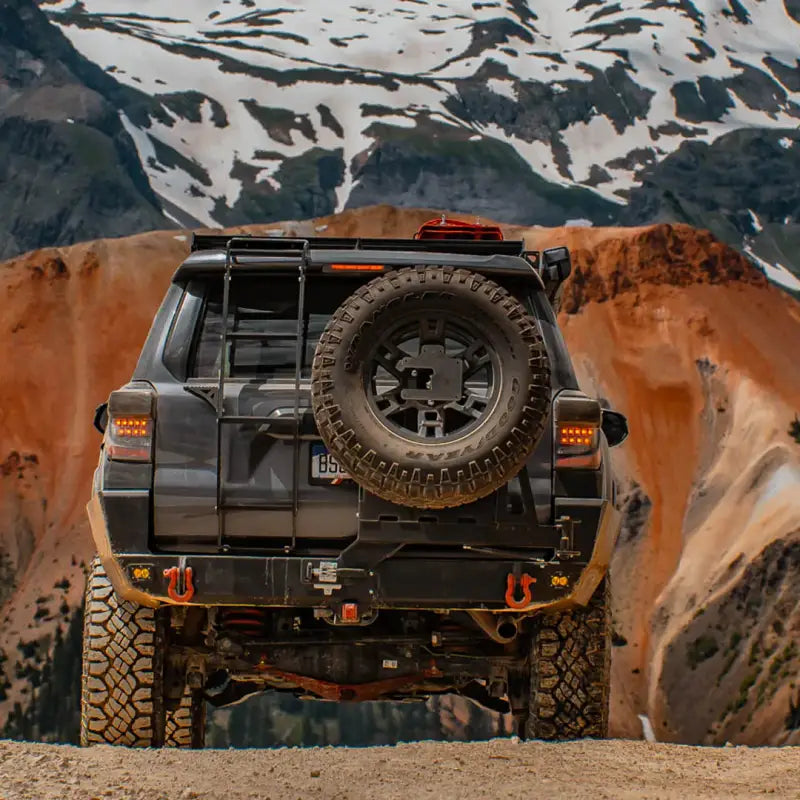 Gray SUV with rear-mounted spare tire showcasing Overland Series Rear Bumper for 4Runner