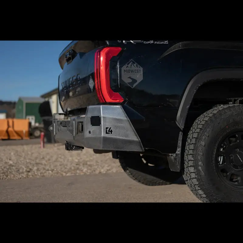 Side view of raw steel Tundra Overland Rear Bumper for 2022+ models, highlighting durable construction and sensor support.