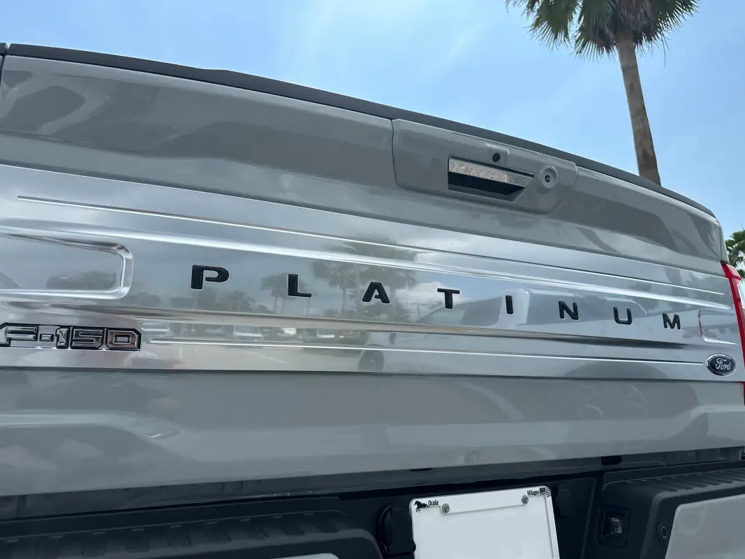 Gray Ford F-150 Platinum tailgate with letter inserts for 2021-2024 models