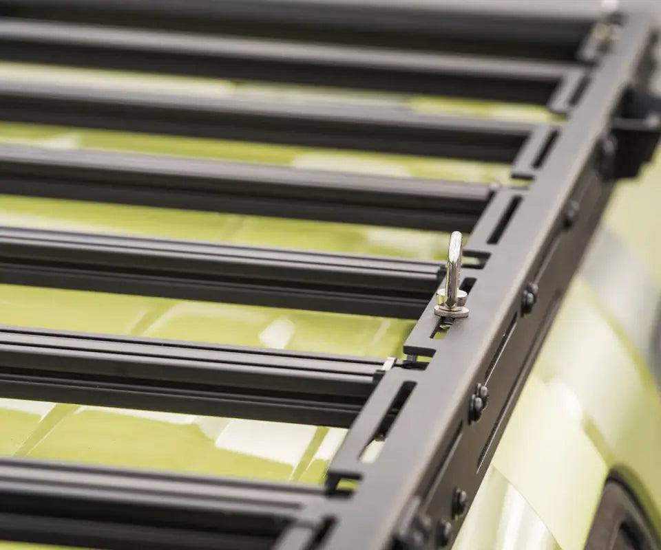 Detail of Prinsu Pro Roof Rack crossbars and drop-in points on a Toyota 4Runner, showcasing its modular and secure design.