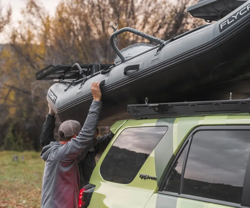 Toyota 4Runner with Prinsu Pro Roof Rack loaded with a kayak, highlighting its strength and utility for outdoor adventures.