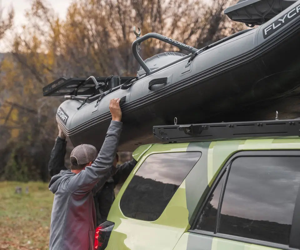 Toyota 4Runner with Prinsu Pro Roof Rack loaded with a kayak, highlighting its strength and utility for outdoor adventures.