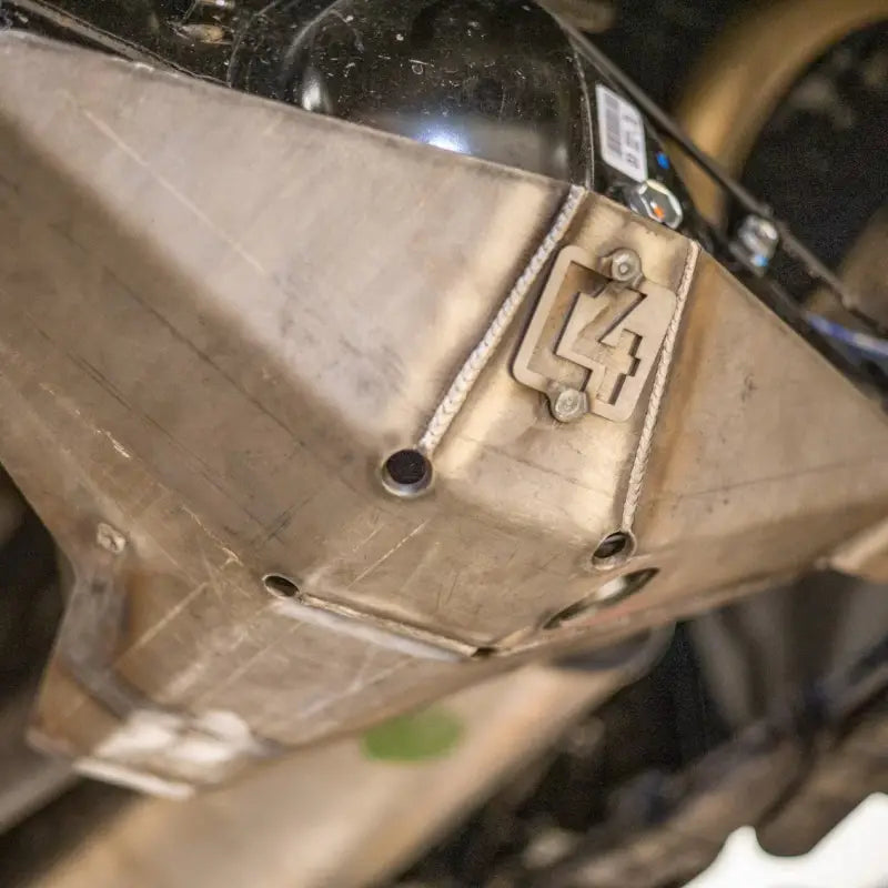 Close-up view of Tacoma rear differential skid plate for 2016+ 3rd Gen models, showcasing steel construction and welded design.