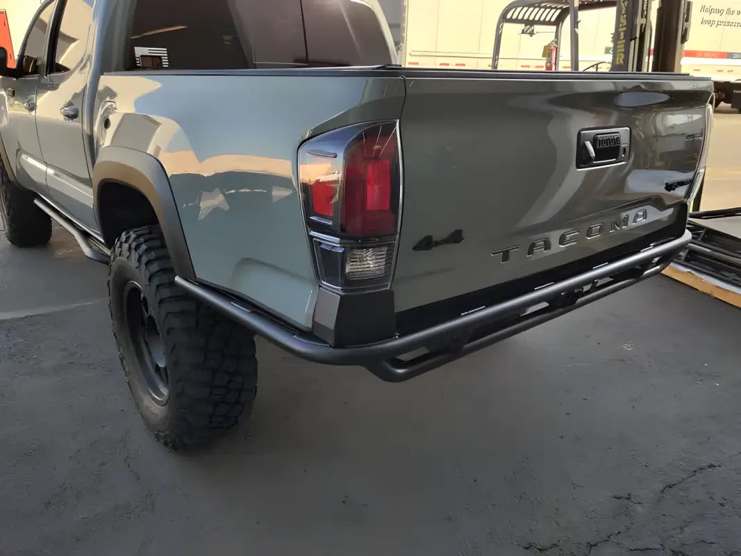2016+ Tacoma Tube Bumper - High Clearance on a silver Toyota Tacoma, emphasizing its sleek design and compatibility with off-road builds.
