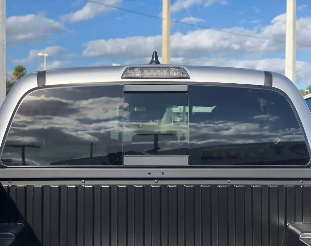 Lime green rear power sliding window accent overlays for 2016-2023 Toyota Tacoma, offering a vibrant and eye-catching style.
