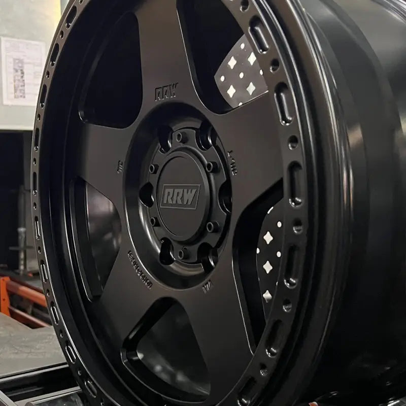 Black five-spoke monoforged series wheel with embossed ABS and decorative rim