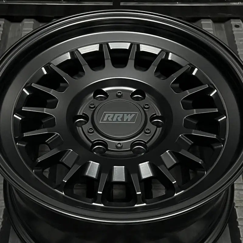 Matte black RRW wheel from the RG7-S MonoForged Series with lug nuts and center caps