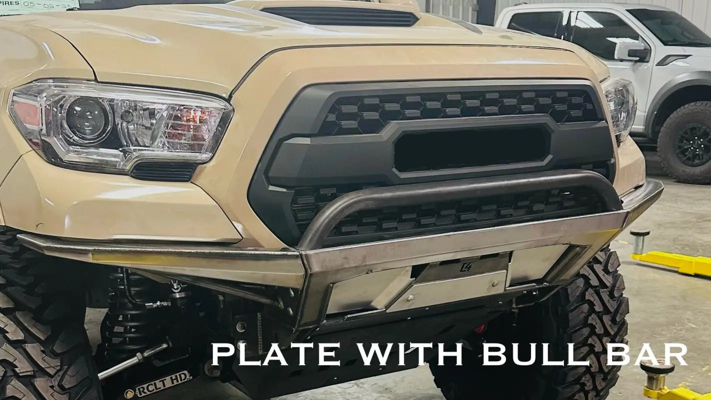 Tacoma Rock Runner Front Bumper with bull bar attachment, highlighting robust steel build and winch compatibility.