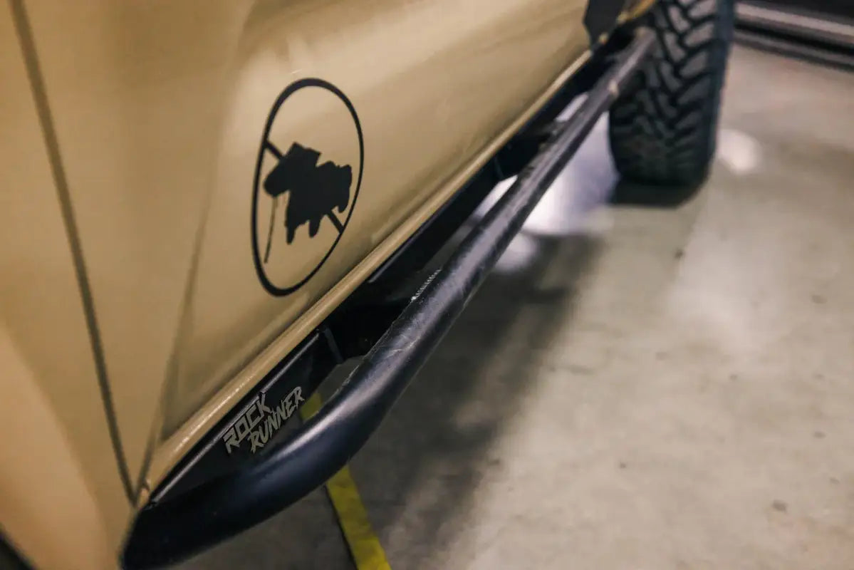 Side view of Tacoma Rock Runner Sliders installed on a 2016+ model, emphasizing sleek design and durable construction.