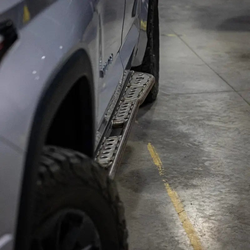 Side view of Tundra rock sliders on a 3rd Gen 2022+ truck, featuring durable DOM tubing and bolt-on installation.