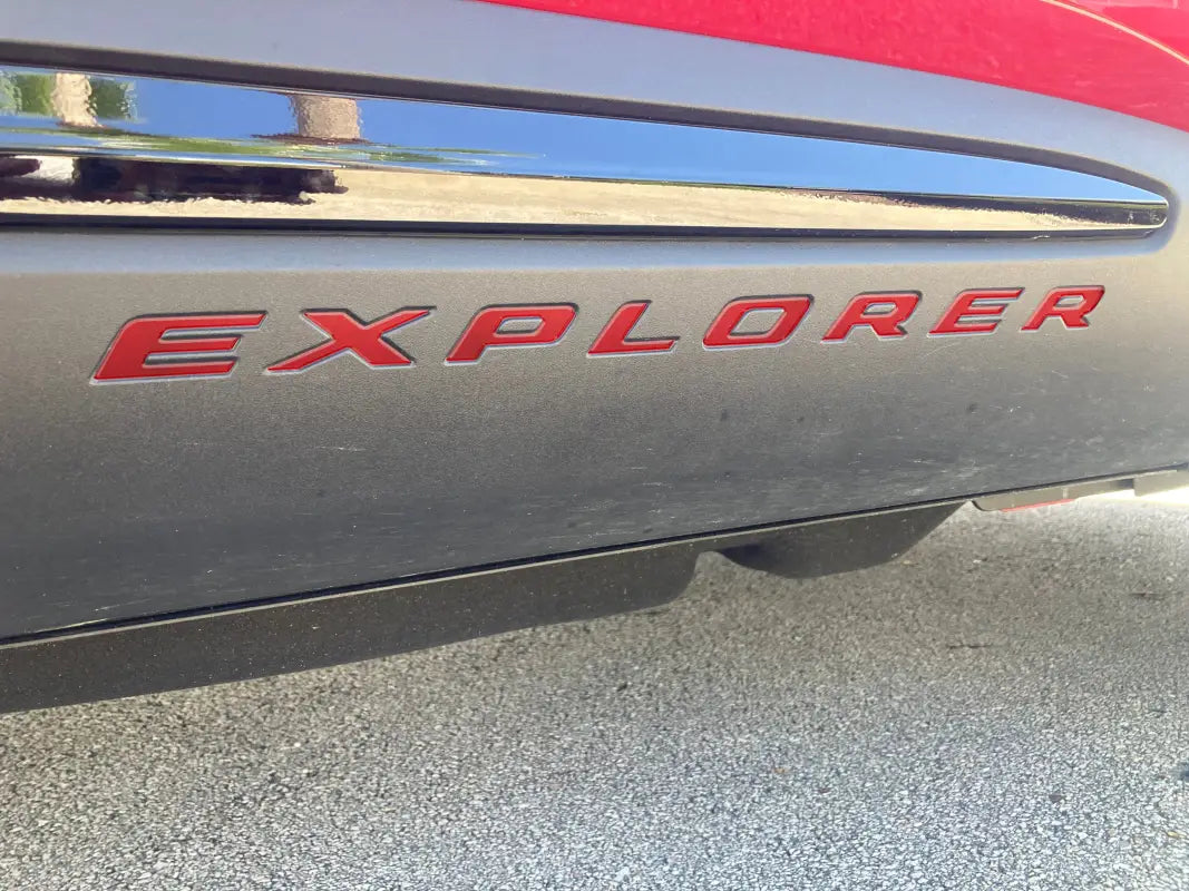 Red Explorer rocker panel letter inserts on a Ford Explorer vehicle for customization