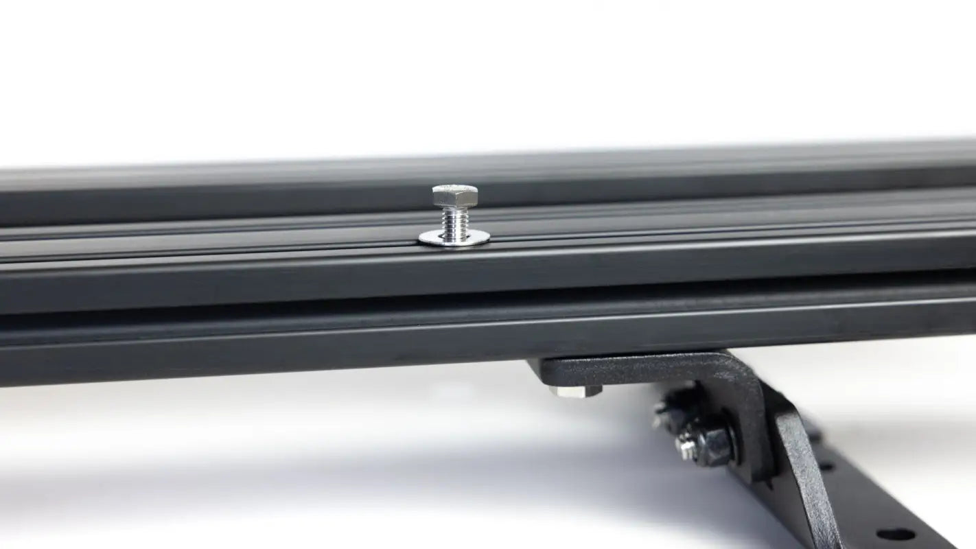 Close-up of a bolt securing the Roof Track Load Bars, demonstrating the robust and adjustable design for various cargo needs.