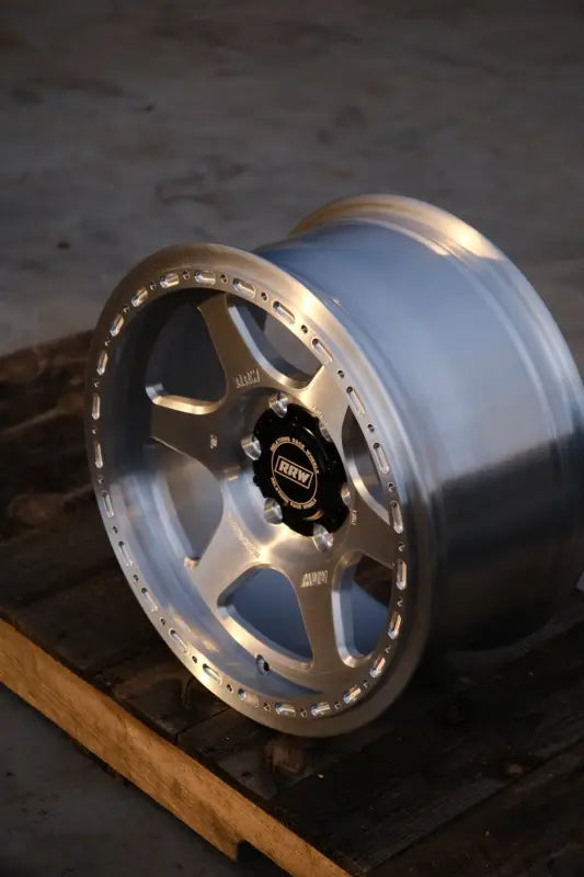 Silver and black off-road wheel from RS2-H Hybrid MonoForged Series with lug nuts