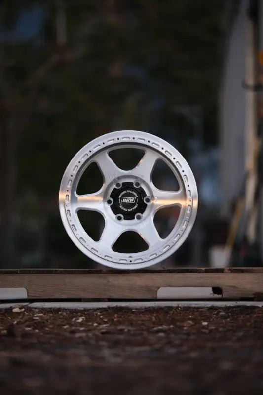 Silver six-spoke monoforged series wheel with lug nuts and high load rating BRUSHED ALUMINUM