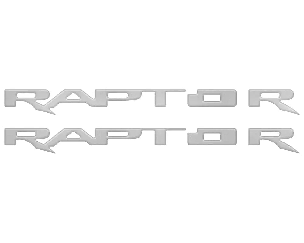 Two silver RAPTOR emblem overlays for running boards on 2017-2025 Ford Raptor