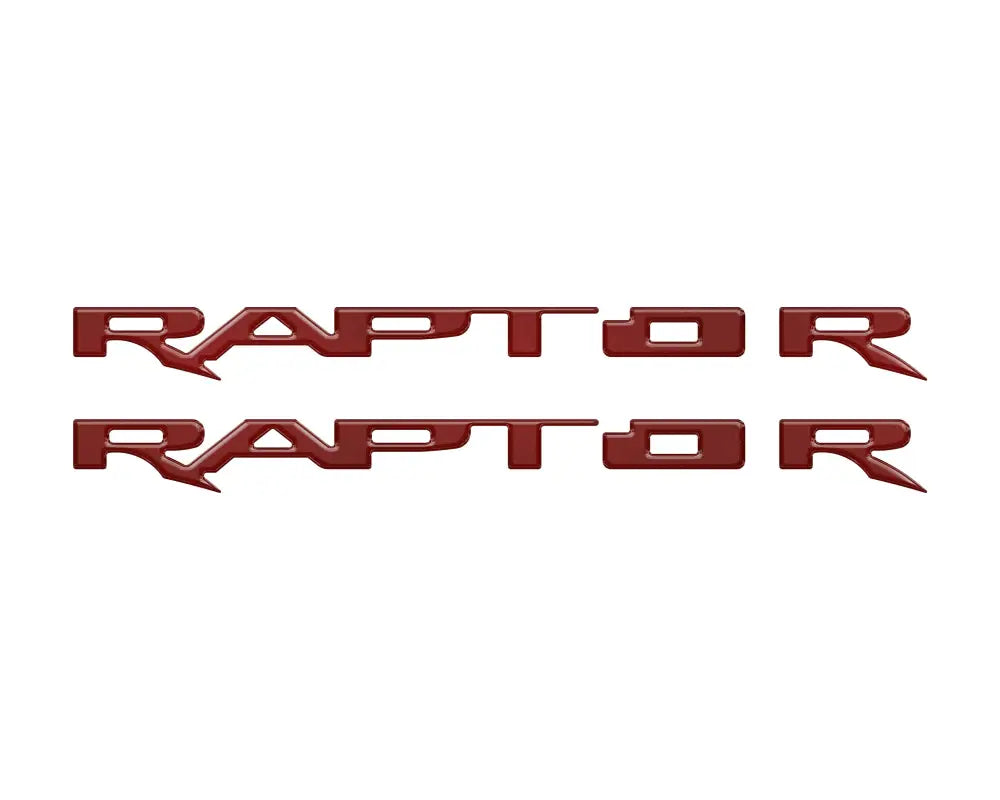 Two red RAPTOR emblem overlays for running board emblem enhancements on Ford Raptor