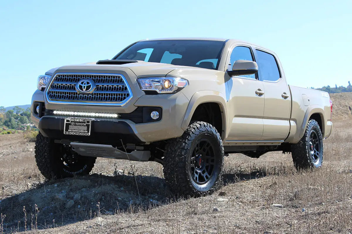 Tan Toyota Tacoma pickup truck with S8 30 inch LED light bar bumper kit