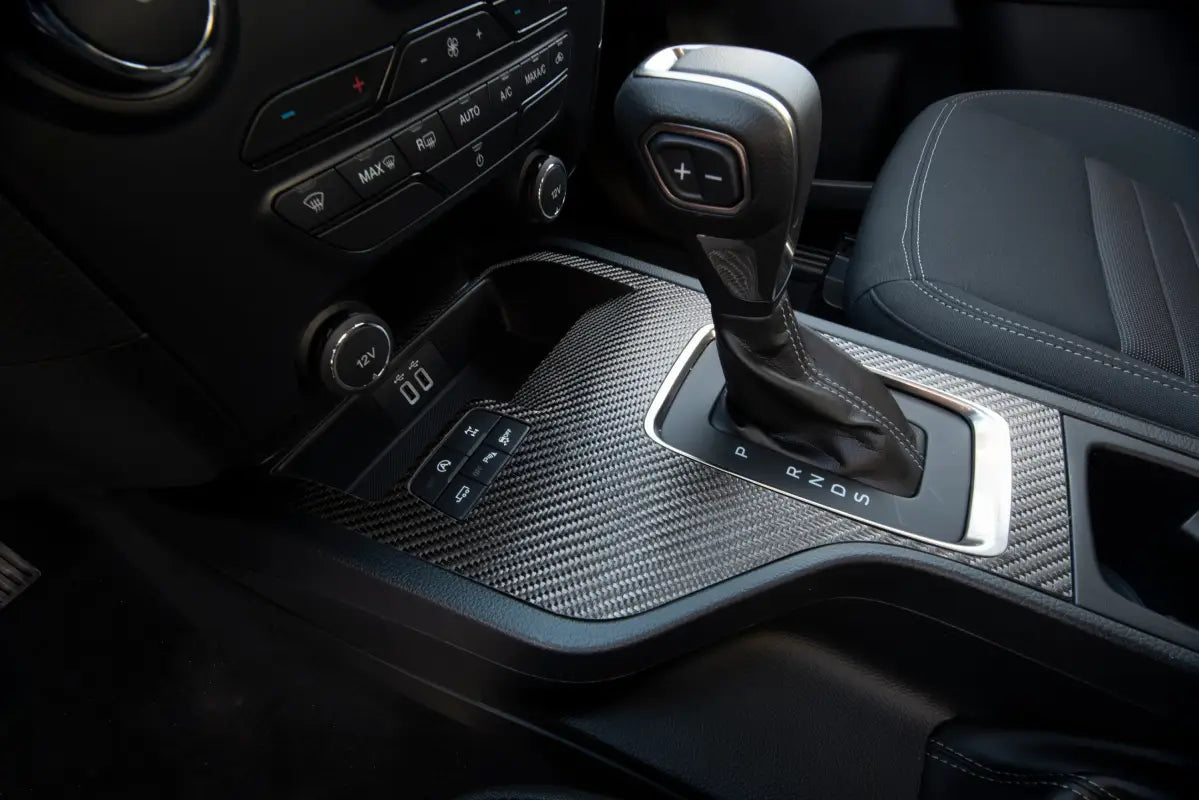 Car’s center console with gear shift featuring Shift Surround Accent Overlay for Ford Ranger