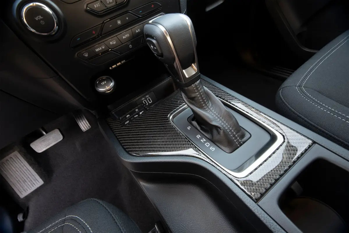 Car’s center console with carbon fiber trim featuring Shift Surround Accent Overlay for Ford Ranger