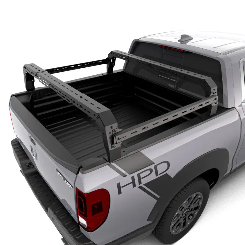 Top view of Honda Ridgeline truck bed featuring a durable modular rack system with no-drill installation and accessory compatibility.