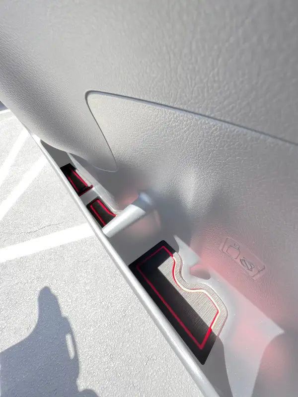 Side door cubby foam inserts with red accents installed in a 2010-2024 Toyota 4 Runner, enhancing interior decor and protection.