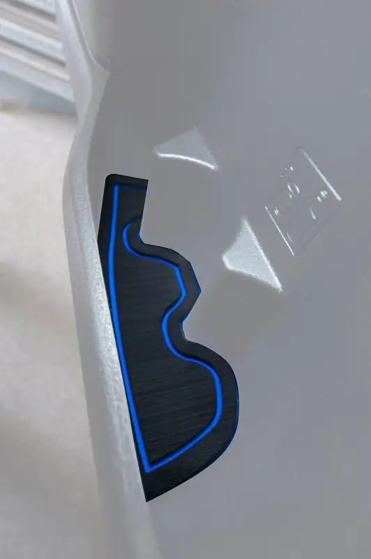 Side door pocket cup holder insert with blue trim installed in a 2016-2023 Toyota Tacoma, showcasing a precise fit and sleek design.