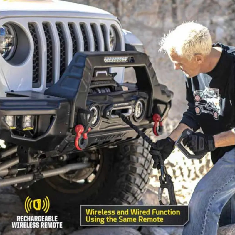 Smittybilt X2O GEN3 winch mounted on a Jeep, demonstrating wireless and wired functionality with ergonomic remote.