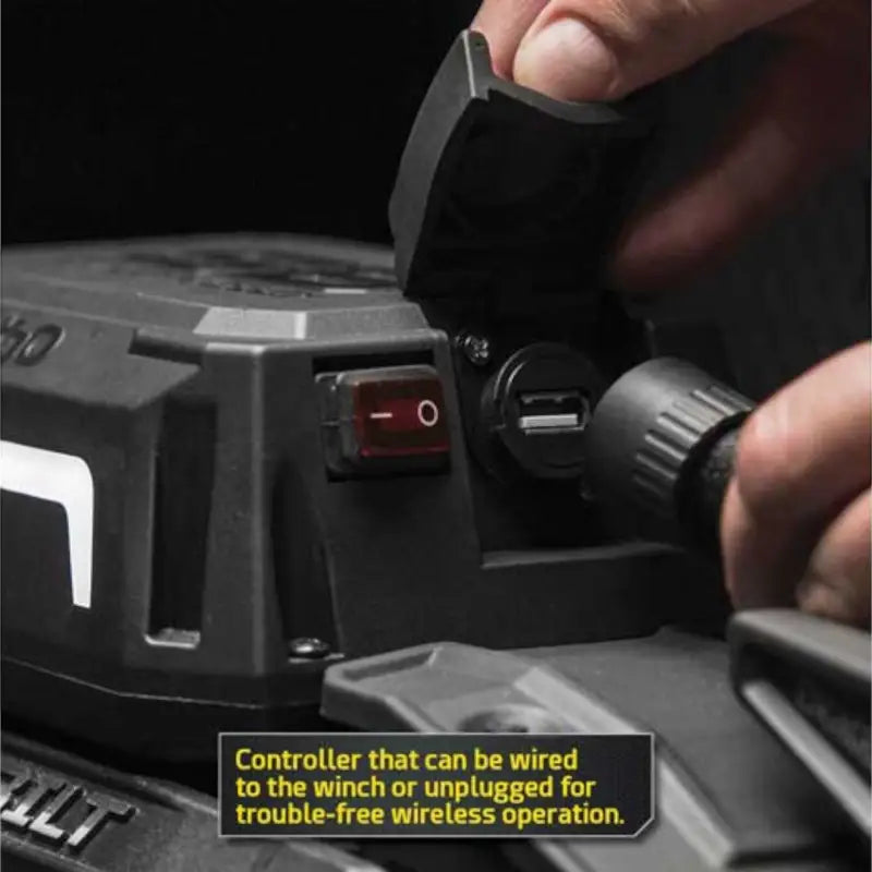 Close-up of Smittybilt X2O GEN3 winch control box with USB charging port and wired or wireless operation options.
