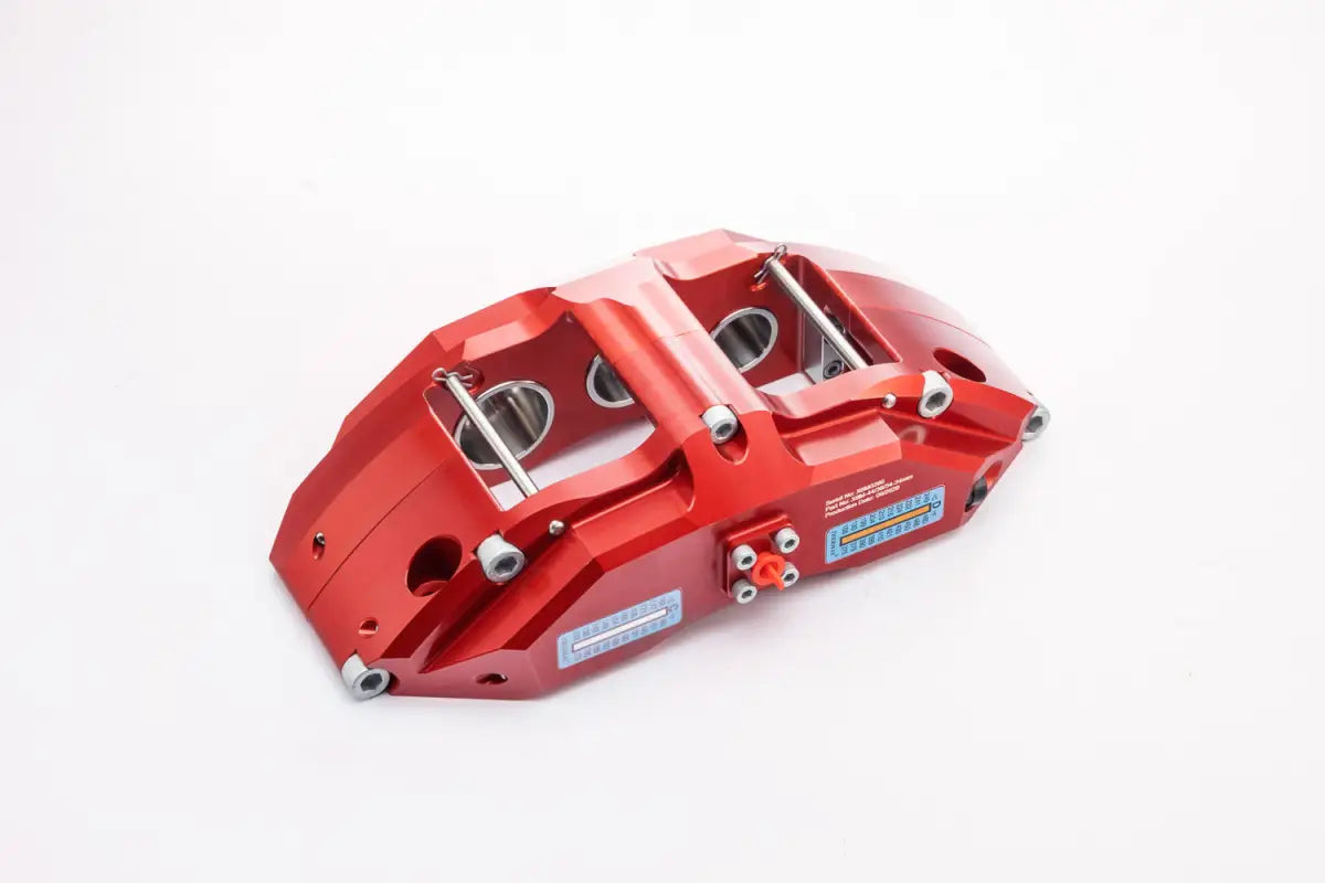 Angled view of the red 6-piston PowerBrake caliper for Wrangler JK, designed for superior braking performance.