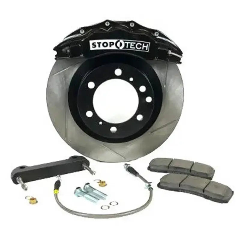 Black StopTech 6-piston caliper with slotted rotor, brake pads, and hardware for Toyota Tacoma big brake kit upgrade.