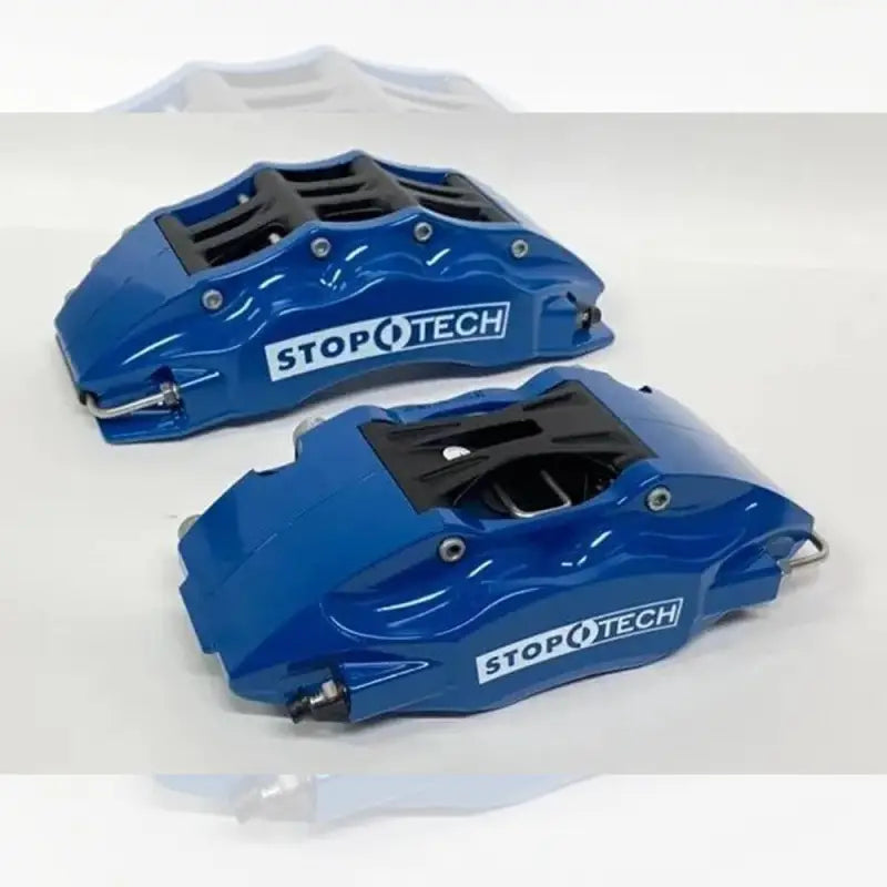 Blue StopTech 6-piston calipers for Toyota Tacoma, offering a stylish and powerful braking solution for off-road and street use.