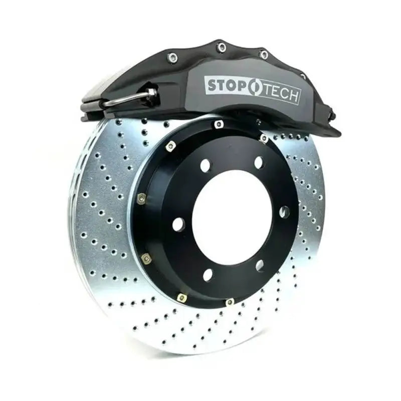 Toyota Tacoma big brake kit featuring black StopTech 6-piston caliper and drilled rotor for improved stopping power.