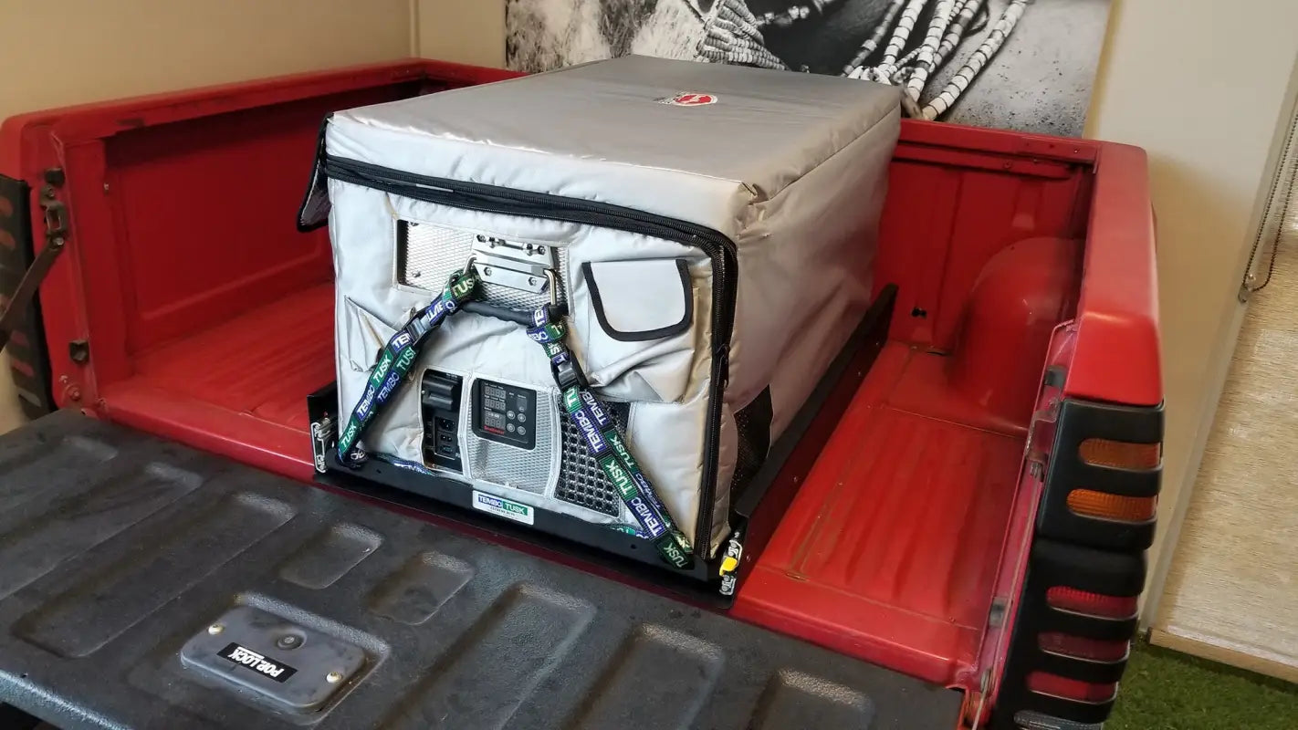 SUPER Jumbo Side Pull Slide in a truck bed setup, showcasing its secure fridge mounting for rugged outdoor and camping adventures.