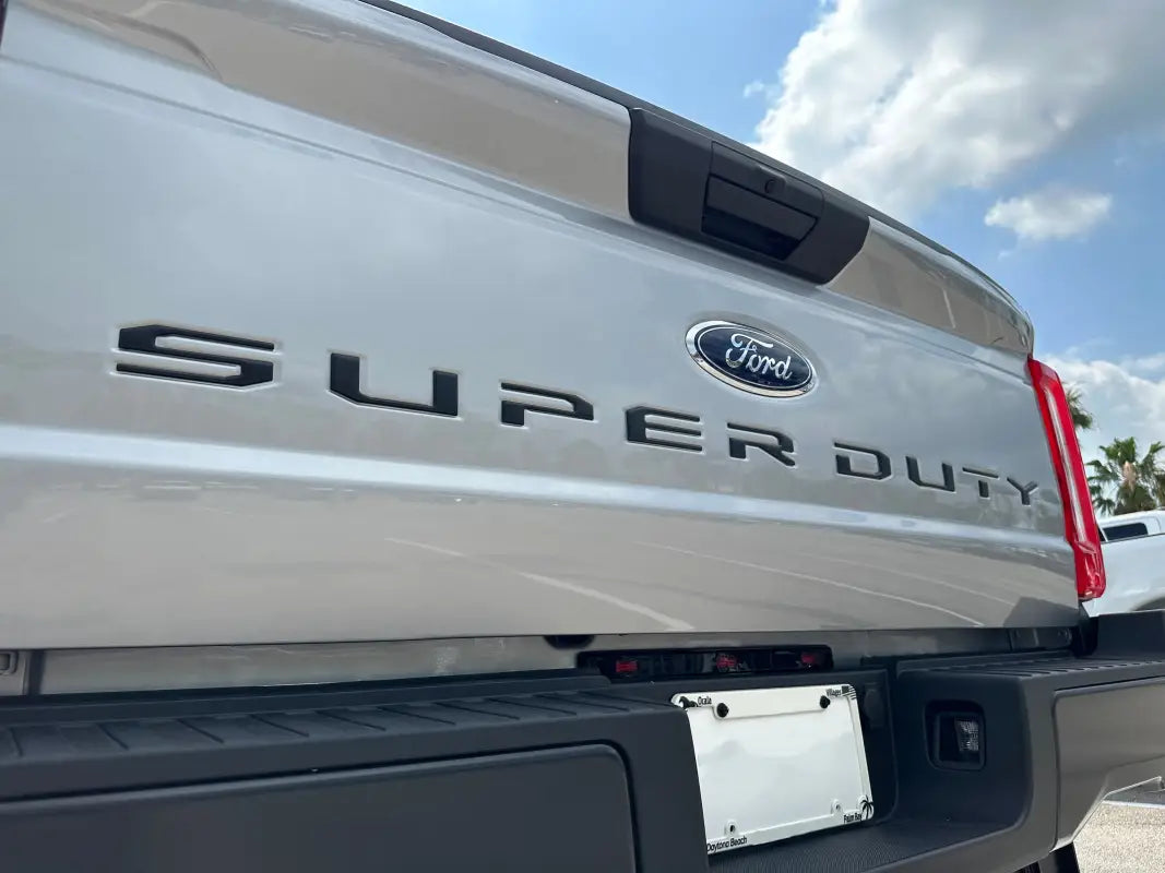 Silver Ford Super Duty tailgate with letter inserts for 2023-2024 models