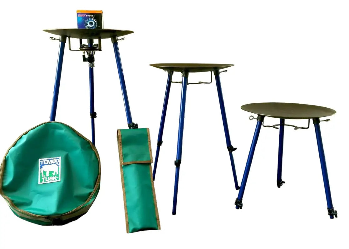 TemboTusk Skottle Grill Kit showing adjustable legs in three heights, Kovea Scout Stove, and green carry bag for easy transport.