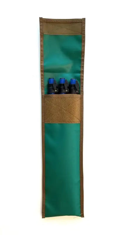 TemboTusk green storage pouch with adjustable blue legs neatly stored, ideal for camping and outdoor cooking setups.