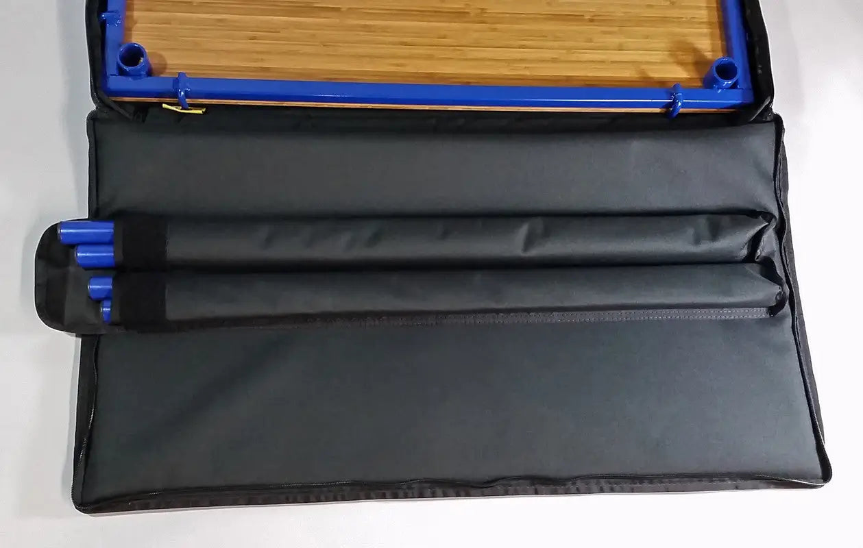 TemboTusk Camp Table Kit case interior showing stored adjustable legs and bamboo components. Compact and organized design.