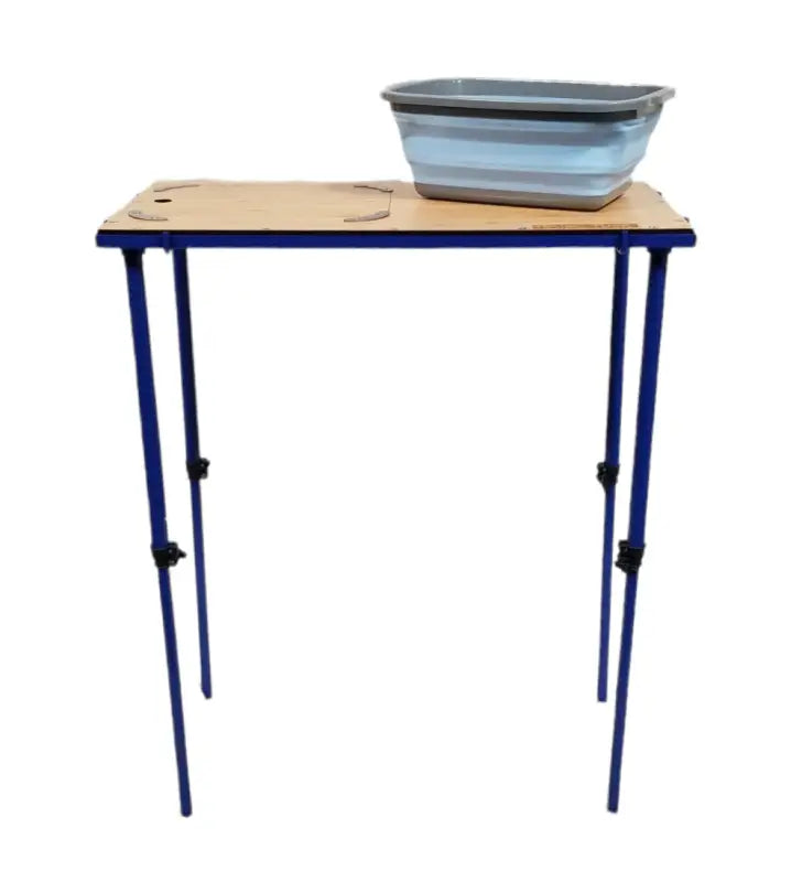 TemboTusk Camp Table with collapsible blue basin on bamboo top and adjustable legs. Compact and versatile for camping.