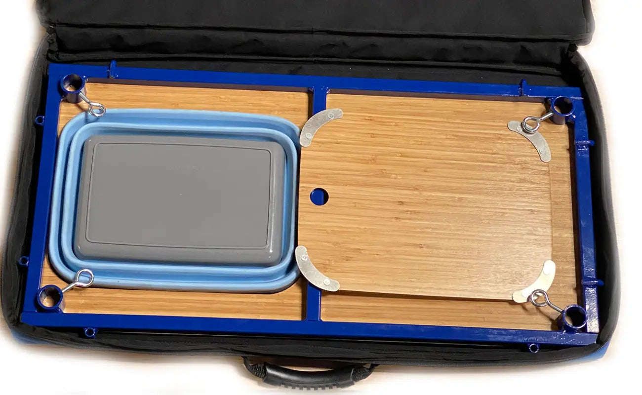 TemboTusk Camp Table Kit packed in a compact case with collapsible blue basin and bamboo components. Easy to store and transport.