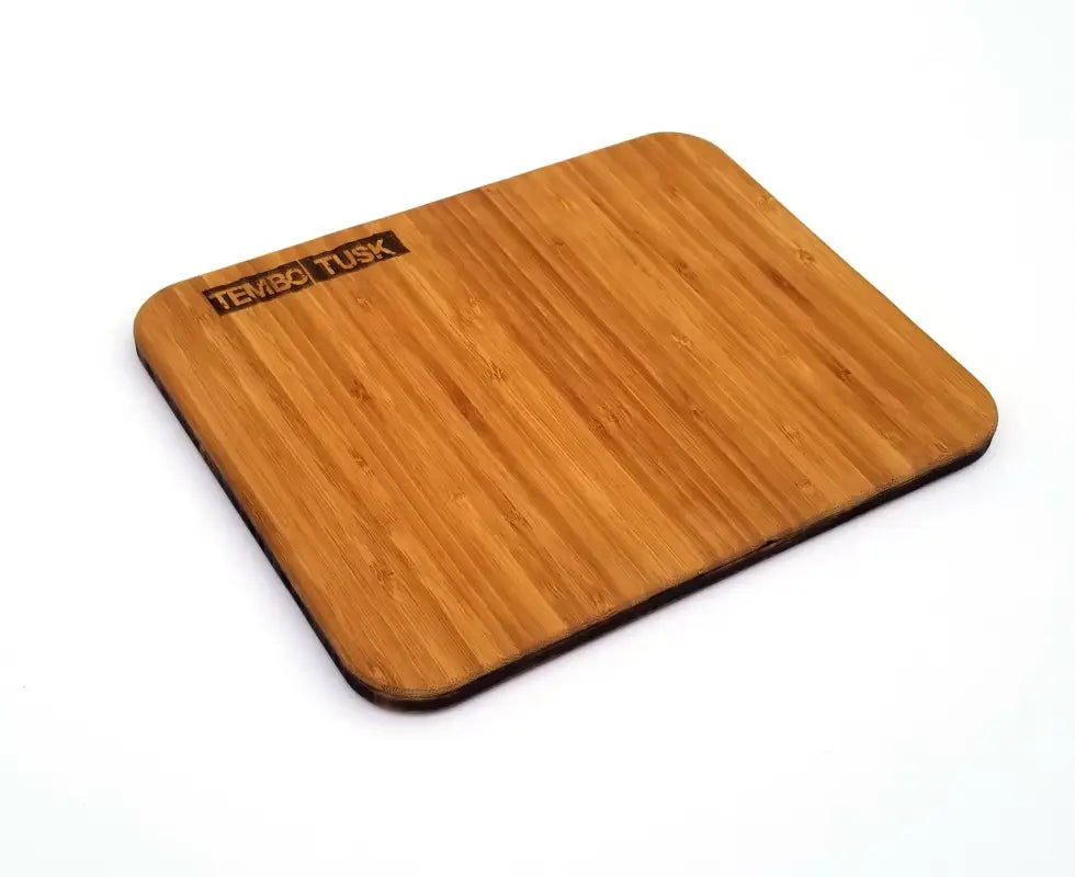 TemboTusk bamboo cutting and charcuterie board, pre-oiled with Buzzy Waxx, featuring a compact 8x10-inch design and rounded edges.