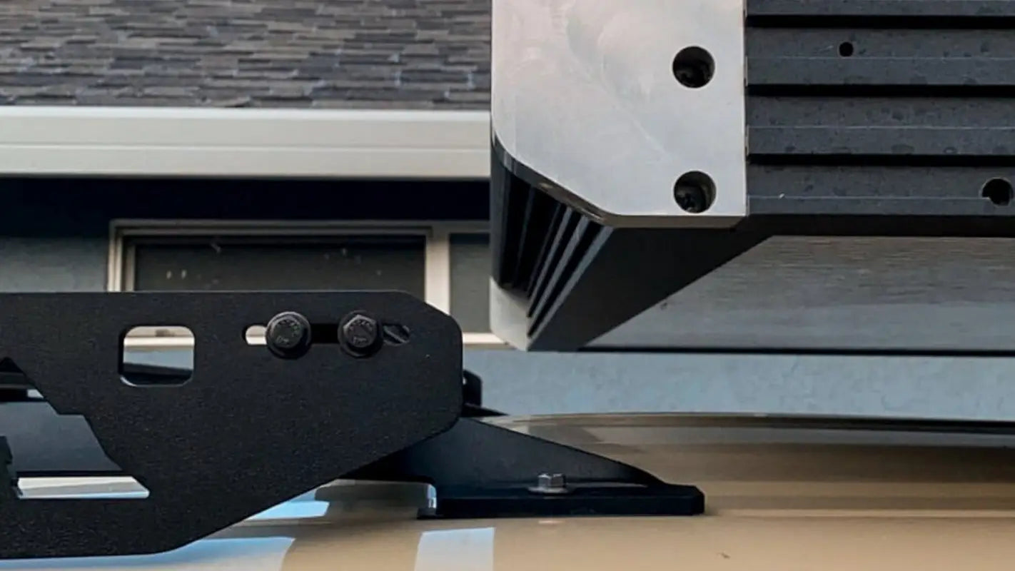 Side view of Animas roof rack crossbars and mounting brackets, demonstrating its robust and practical build.