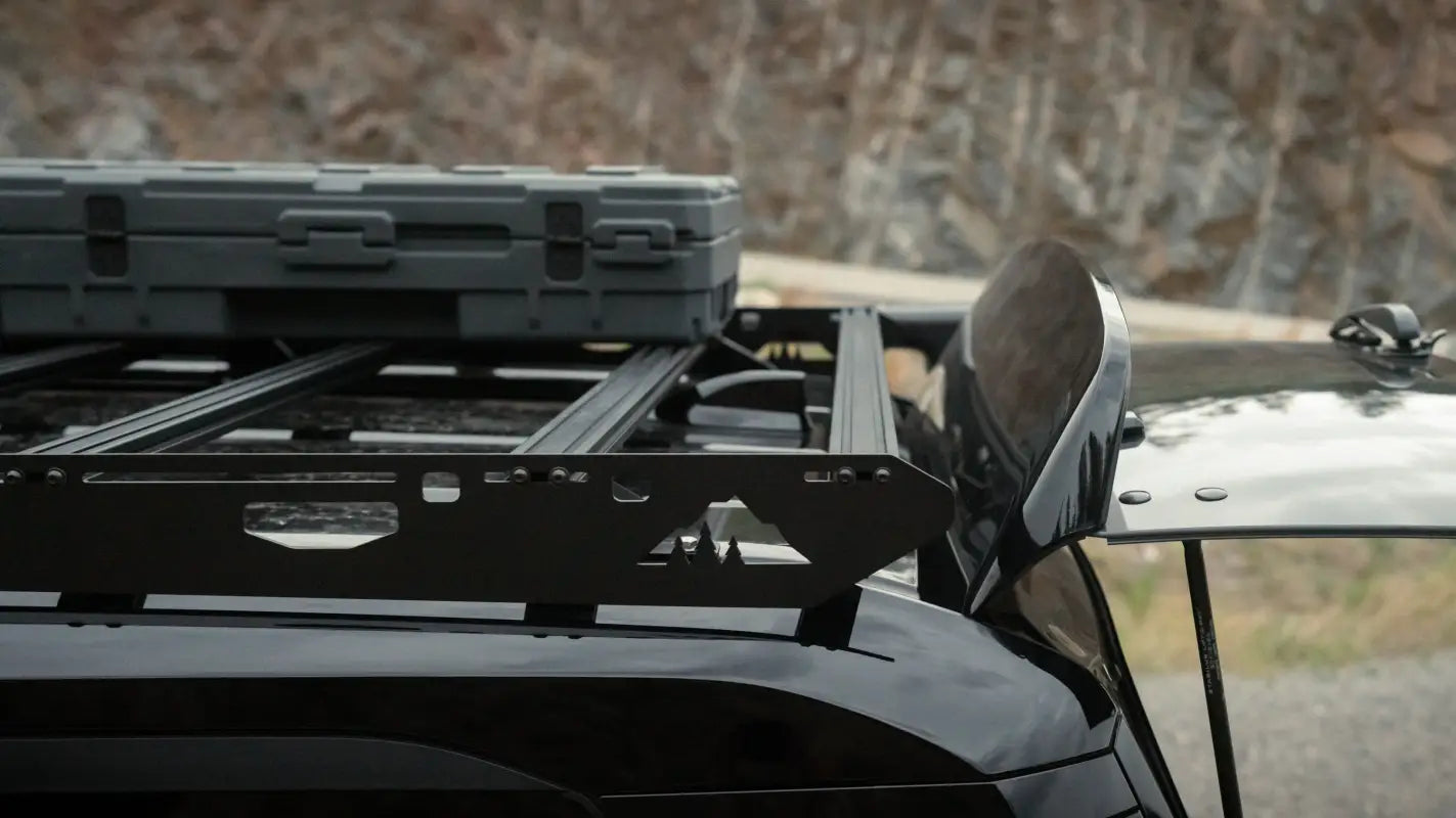 Close-up of The Atlas roof rack on a 2024 Toyota Land Cruiser, showing its modular design and mounted storage box.